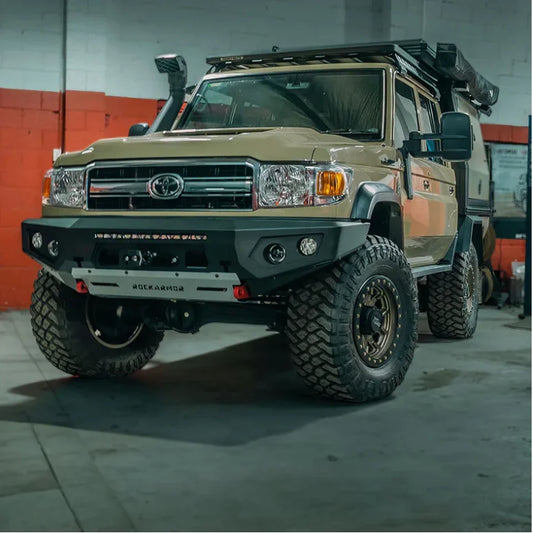 Tan Toyota Land Cruiser with off-road modifications and Rockarmor GT Steel Bull Bar with driving lights