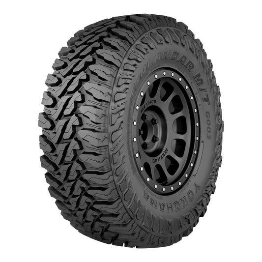 Mud-terrain tire with detailed tread pattern on a white background