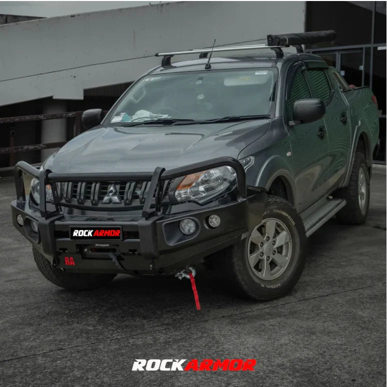 Gray Mitsubishi pickup truck with black elite bullbar and synthetic winch rope installed