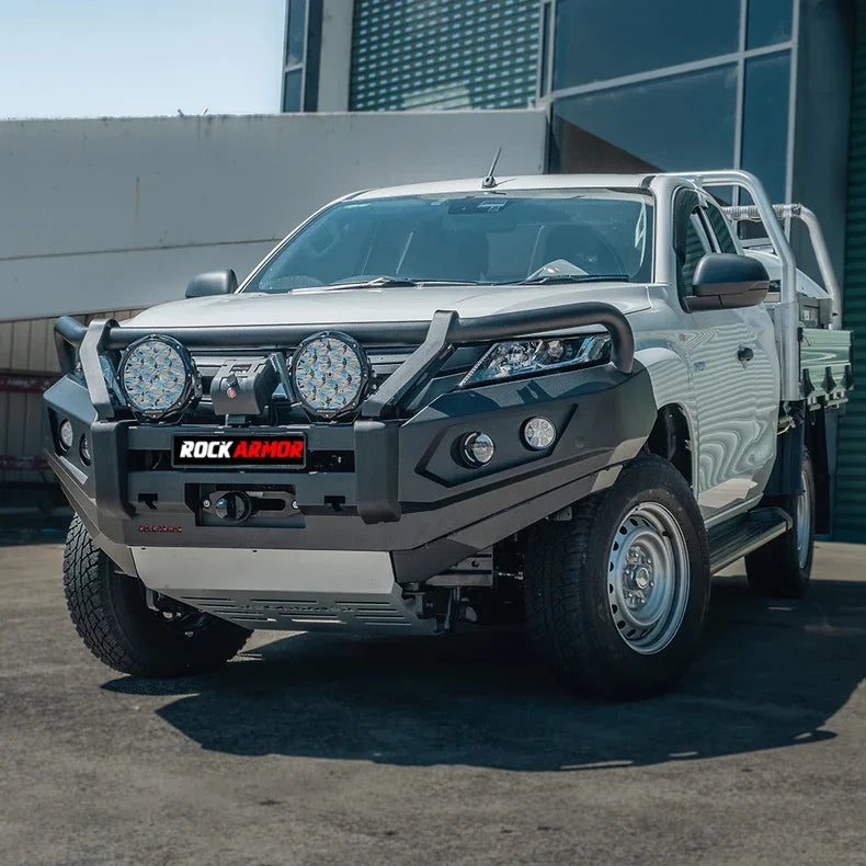 Silver pickup truck with aftermarket Rockarmor GT Steel bull bar and driving lights
