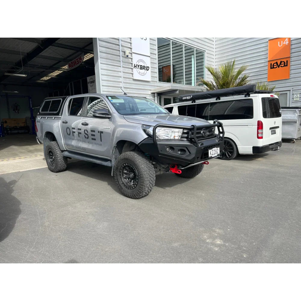 Gray pickup truck with Rockarmor GT Steel Hoop Bullbar and driving lights installed