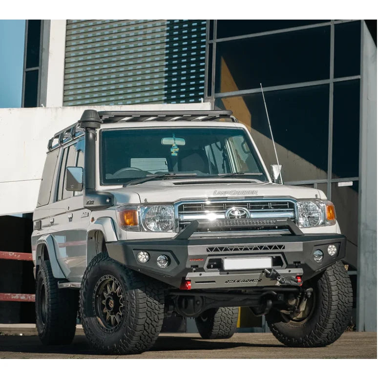 White Toyota Land Cruiser with off-road modifications featuring Rockarmor Gt steel hoopless bullbar