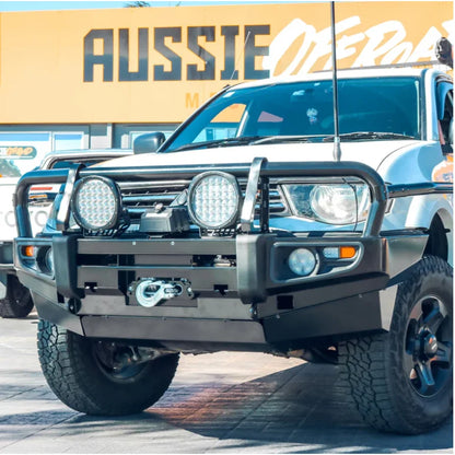 White off-road vehicle with steel bullbar and fog lights suitable for Mitsubishi Triton 2009-2015