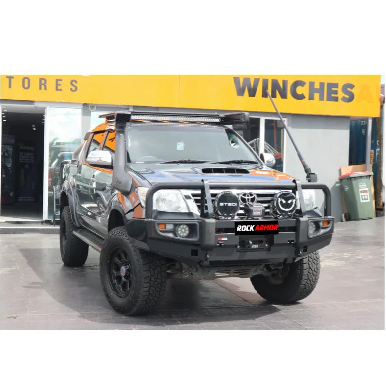 Modified gray pickup truck with Rockarmor premium steel bullbar and fog lights