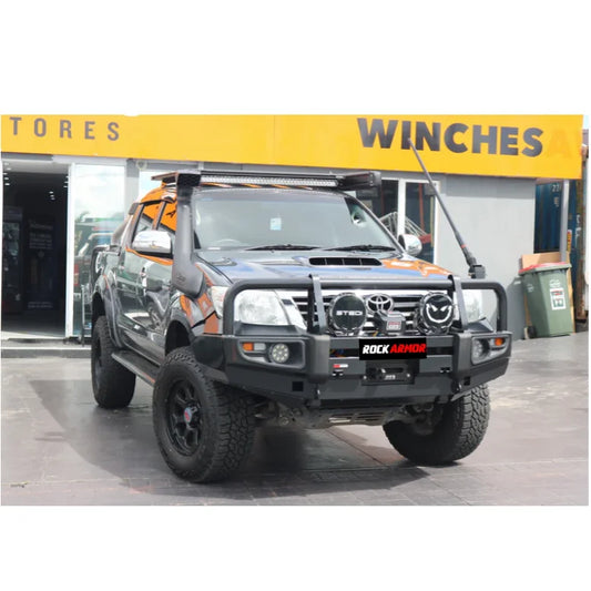 Modified gray pickup truck with Rockarmor premium steel bullbar and fog lights