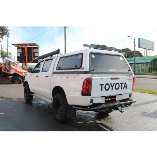 White Toyota pickup truck with Rockarmor premium steel rear step tow bar for Hilux N70