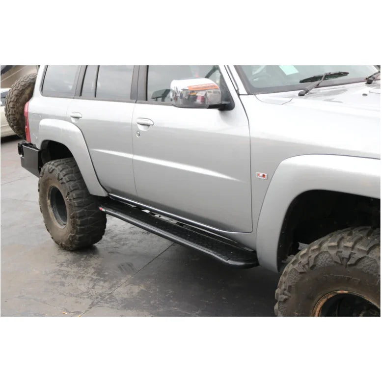 Silver off-road vehicle with steel checker plate Rockarmor Steel Rockslider side steps for Nissan Patrol Y61 GU1 GU4 1998 to current