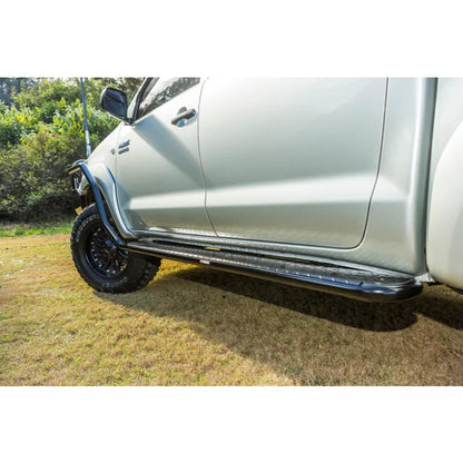 Silver pickup truck with steel checker plate side steps from Rockarmor Steel Rockslider fitting video