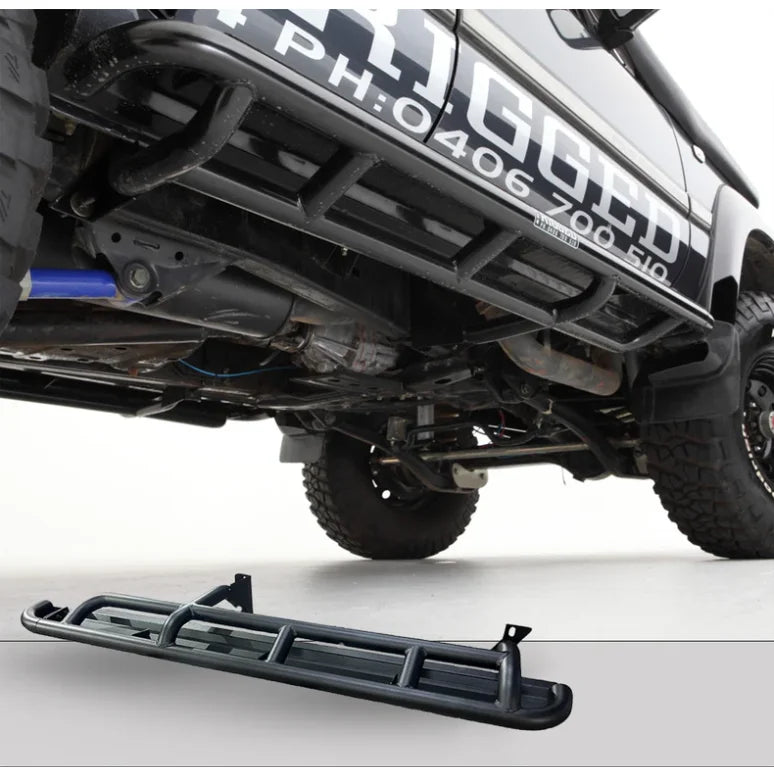 Black metal rock sliders with steel checker plate design for Toyota Landcruiser Fj80 1990-1997